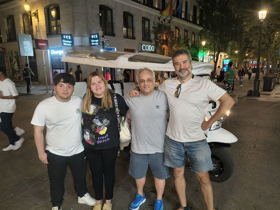 Family on a night Tuk Tuk tour near Puerta del Sol, Madrid